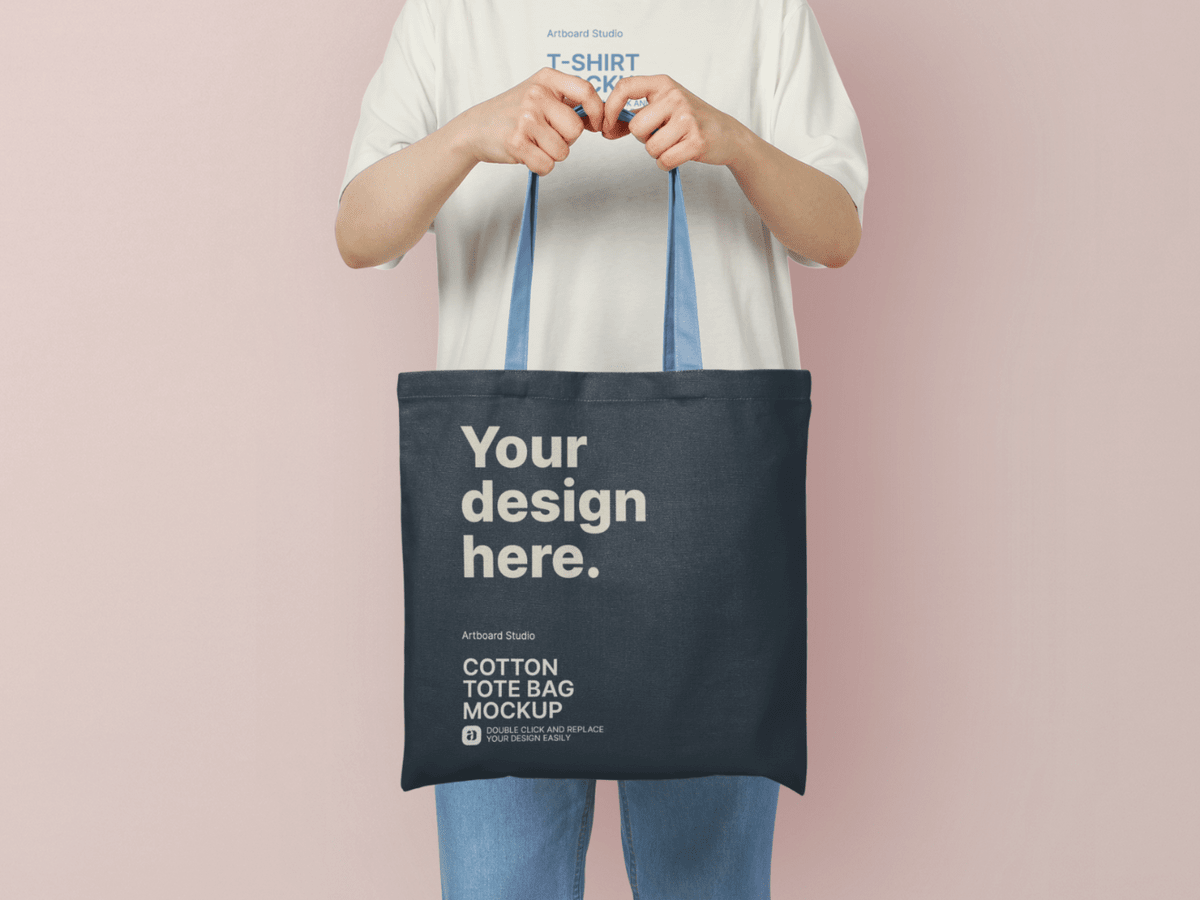 With so much to juggle, it can be difficult to carry the p. A Woman Is Holding Cotton Tote Bag Mockup Template